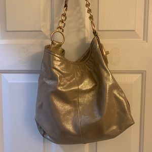 Genuine suede gold and pink coach purse.